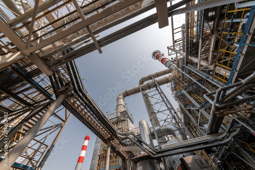 view of metal pipes of industrial plant outdoor at sunny day