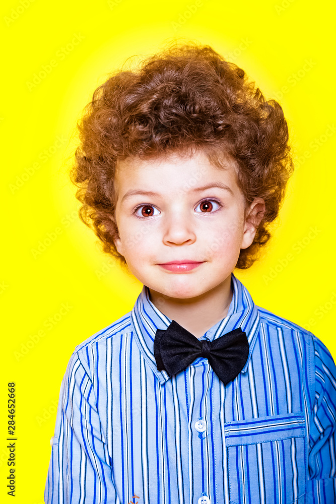 A kid portrait with curly hair on studio A kid portrait with curly hair on studio
