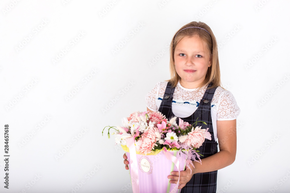 Girl with flowers on white isolated backgroung smiling and happy. Childhood, floral concept Girl with flowers on white isolated backgroung smiling and happy. Childhood, floral concept