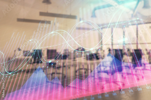 Stock and bond market graph with trading desk bank office interior on background. Multi exposure. Concept of financial analysis