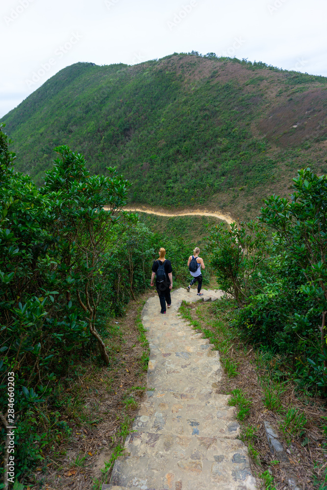 Obraz premium Women hiking in Hong Kong mountains