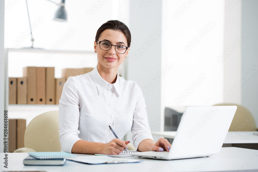 Young beautiful businesswoman with computer Young beautiful businesswoman with computer