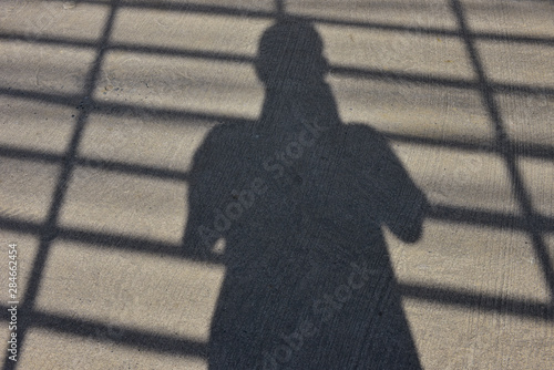 The shadow of human apper on the street. photo