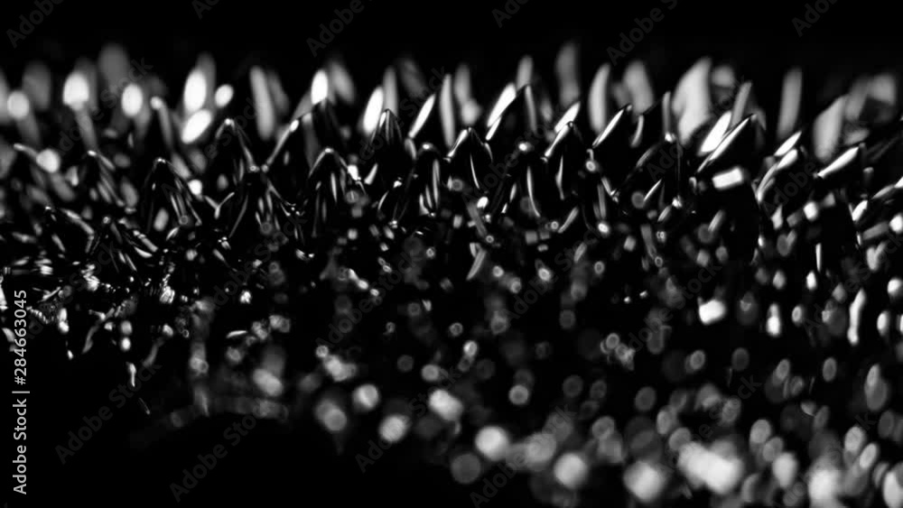 Super Slow Motion Macro Shot of Magnetic Liquid Ferrofluid in Motion at 1000fps. Shooted with High Speed Cinema Camera at 4K. Super Slow Motion Macro Shot of Magnetic Liquid Ferrofluid in Motion at 1000fps. Shooted with High Speed Cinema Camera at 4K.