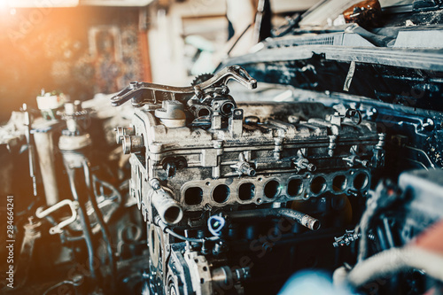 repair of an internal combustion engine of a car. Details of the motor.