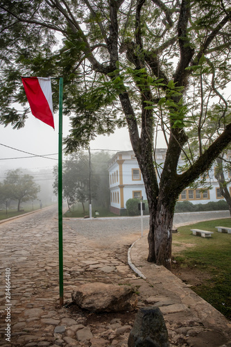 Historic Center with flag and fog in Tiradentes City Minas Gerais Brazil