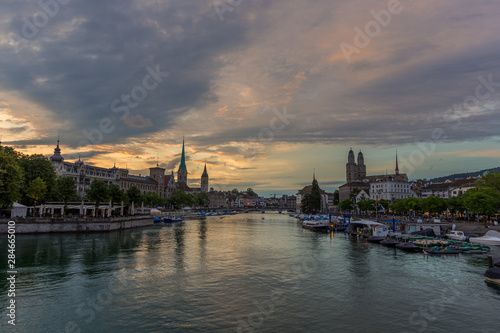 Zurich downtown skyline with Fraumunster and Grossmunster churches at lake zurich at night, Switzerland.