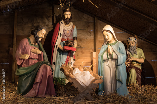 Obraz na plátne A traditional nativity scene with baby Jesus, Joseph and Mary and the wise men from the east who bring gifts