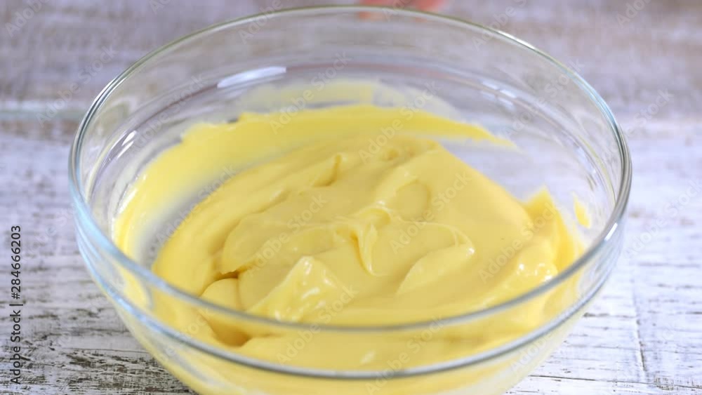 Cooking cream from custard and whipping cream. Process of making a cake. Cooking cream from custard and whipping cream. Process of making a cake.