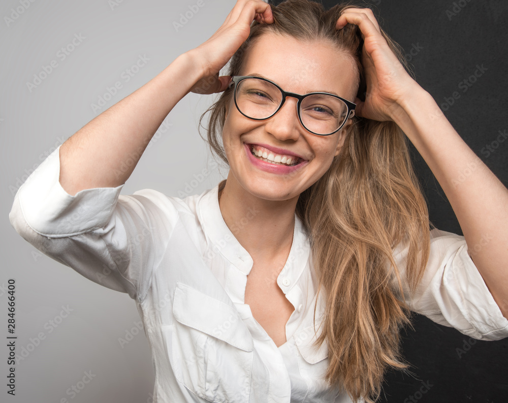 Obraz premium Happy smiling young woman close up face portrait. Smile with teeth