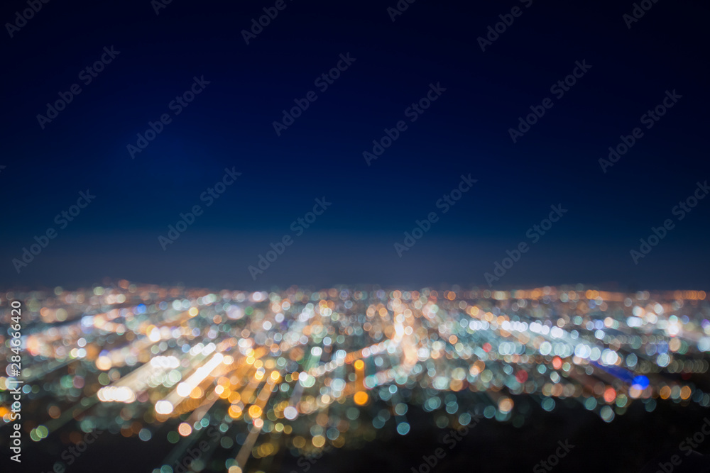 Naklejka premium Abstract, Beautiful Bokeh landscape of city at night, Bokeh light and blur city sunset