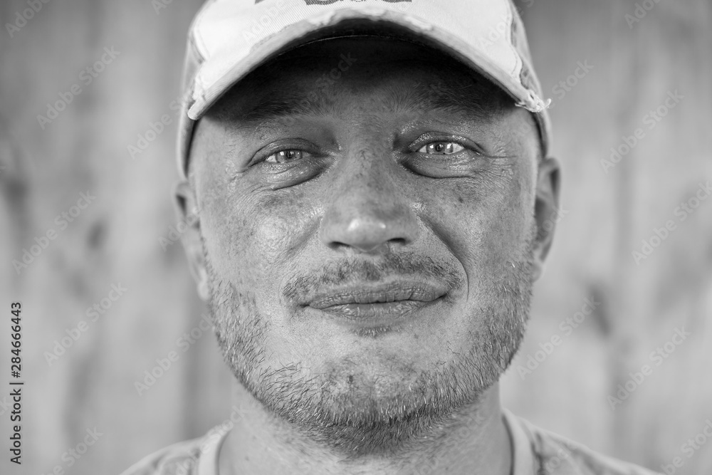Portrait of caucasian man in a cap, close up, black and white Portrait of caucasian man in a cap, close up, black and white
