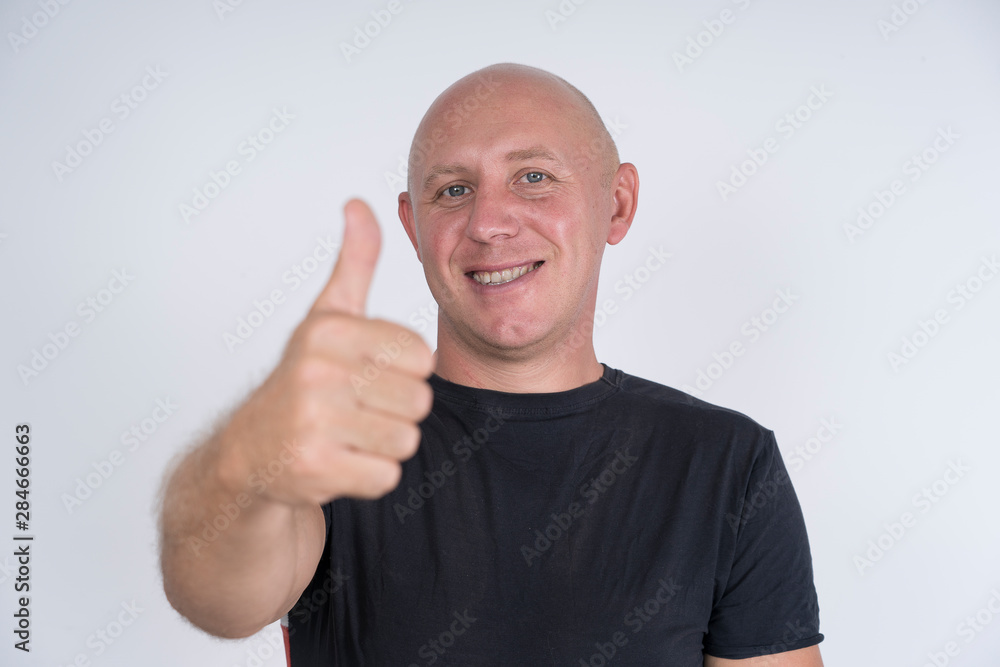 Portrait of an happy bald man, indoors, close up Portrait of an happy bald man, indoors, close up