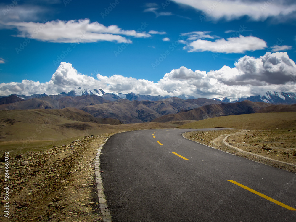 Driving the highway, typical landscape on the road from Rongbuk in the Himalaya of southern Tibet to Zhangmu on the Nepal-China border, Tibet, China, Asia Driving the highway, typical landscape on the road from Rongbuk in the Himalaya of southern Tibet to Zhangmu on the Nepal-China border, Tibet, China, Asia