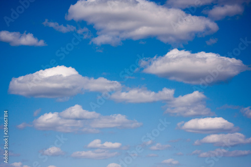 White clouds in the blue sky. Ozone Layer. Blue background