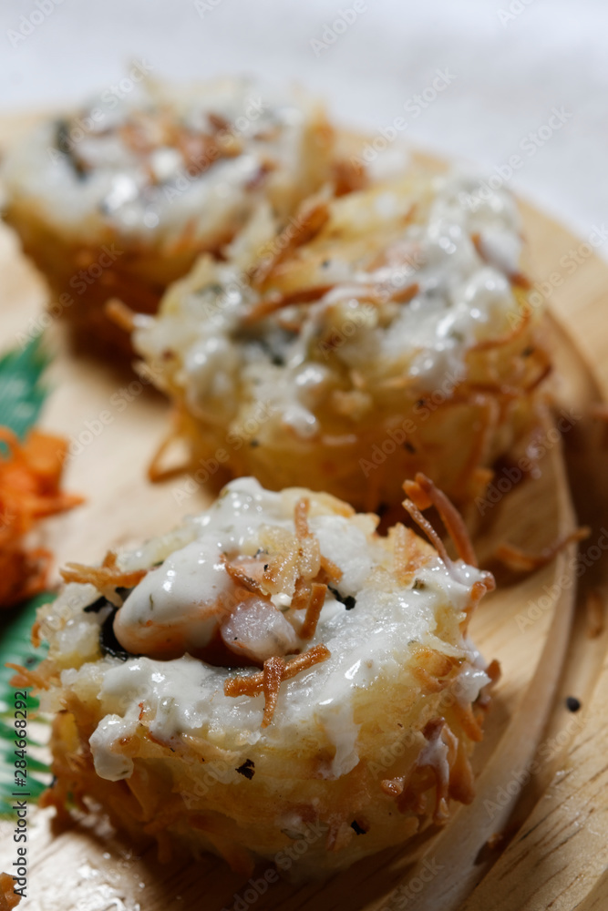 Sushi is traditionally made with medium-grain white rice. It is very often prepared with seafood, such as squid, eel, yellowtail, salmon, tuna or imitation crab meat. Sushi is traditionally made with medium-grain white rice. It is very often prepared with seafood, such as squid, eel, yellowtail, salmon, tuna or imitation crab meat.
