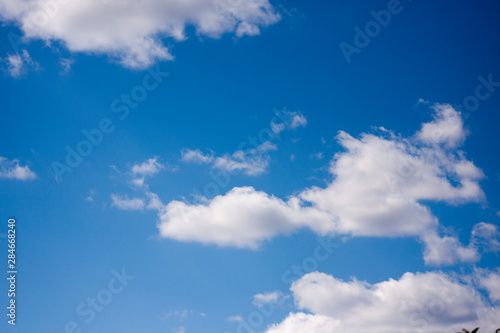 White clouds in the blue sky. Ozone Layer. Blue background