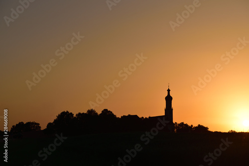 Wallpaper Mural dark silhouette of a small village in Germany with church in the sunset Torontodigital.ca