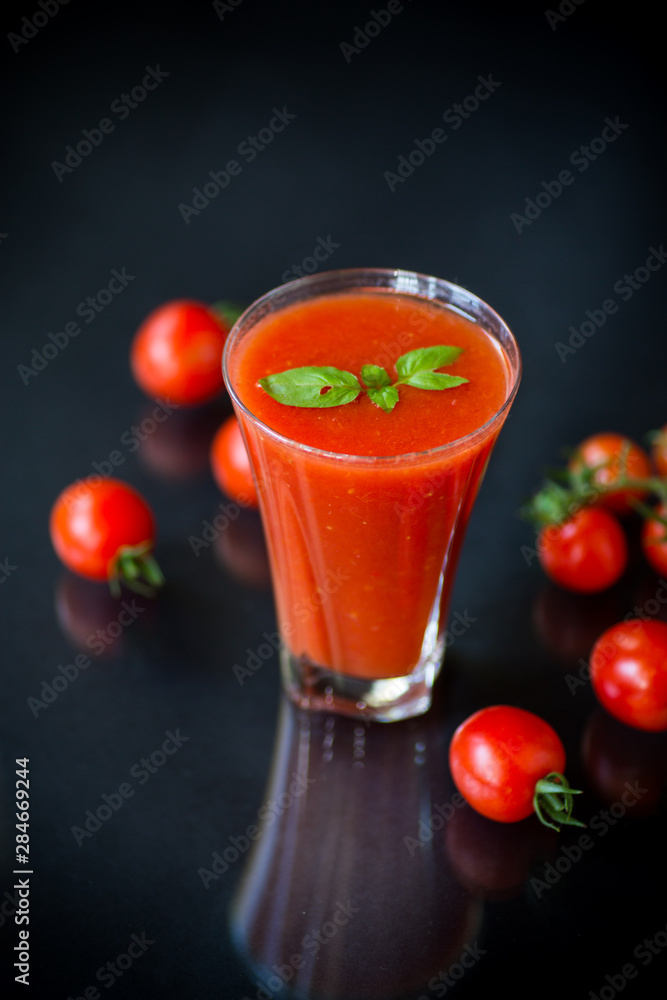 homemade tomato juice in a glass and fresh tomatoes homemade tomato juice in a glass and fresh tomatoes