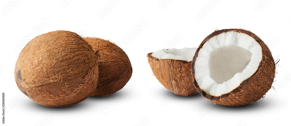 Set with Fresh raw coconut with palm leaves isolated on white background. Set with Fresh raw coconut with palm leaves isolated on white background.