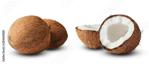 Set with Fresh raw coconut with palm leaves isolated on white background.