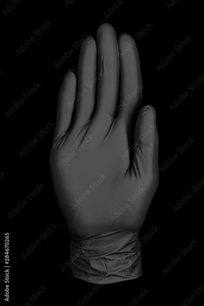 Fototapeta premium black glove on black background / abstract photo background image