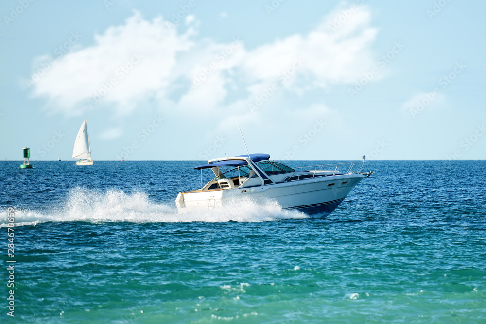 Fototapeta premium modern powerboat speeding on lake