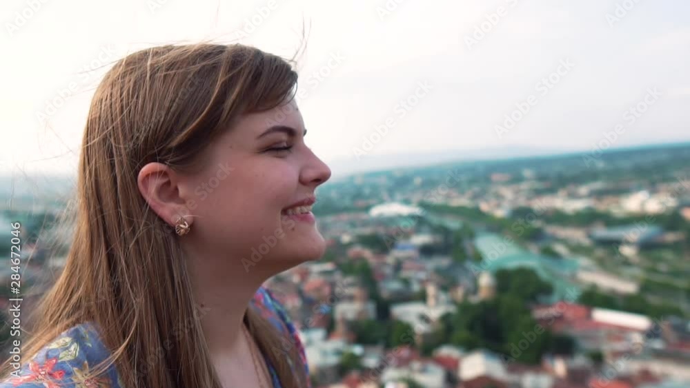 Tourist Travel Vacation. Traveling mountains, freedom and active lifestyle concept. Young girl traveler at cityscape beautiful view background in Tbilisi. Slow mo Tourist Travel Vacation. Traveling mountains, freedom and active lifestyle concept. Young girl traveler at cityscape beautiful view background in Tbilisi. Slow mo