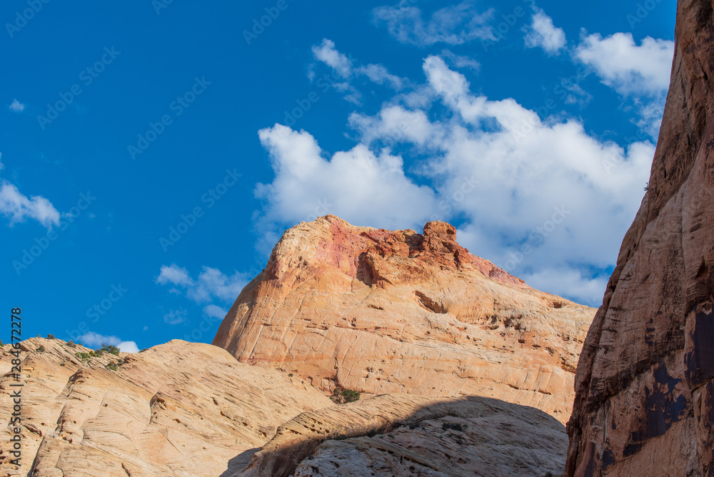 Capitol Reef National Park low angle landscape of colorful stone mountain top