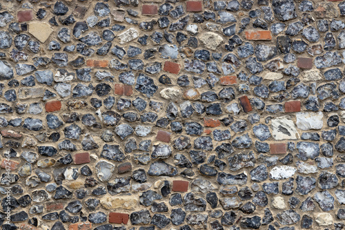 Tableau sur toile Flint pebble stone wall texture graphic resource