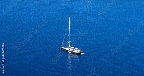 aerial view of boat in the sea and blue water