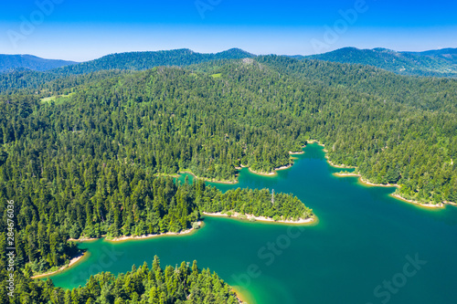 Croatia, Gorski kotar, beautiful Lokvarsko lake, green forest and Risnjak mountain landscape photo