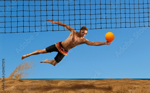 Beach volleyball player in action at sunny day