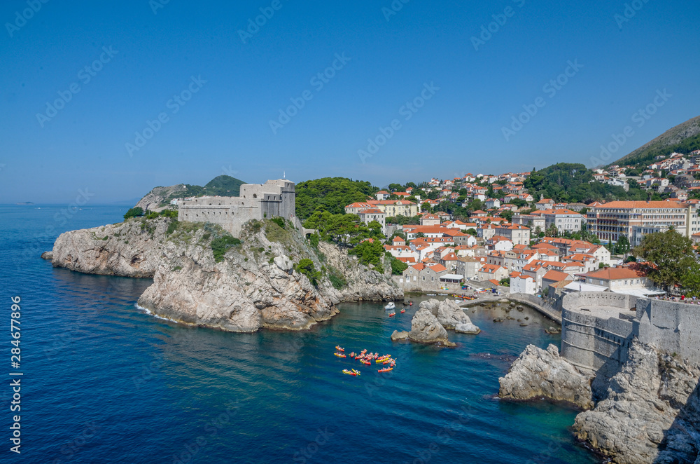 Dubrovnik - Historic Fortresses Lovrijenac and Bokar seen from town's old stone walls in  Croatia.