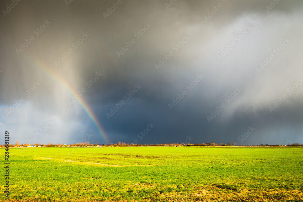 Beautiful dark clouds and a rainbow after a thunderstorm. Beautiful dark clouds and a rainbow after a thunderstorm.