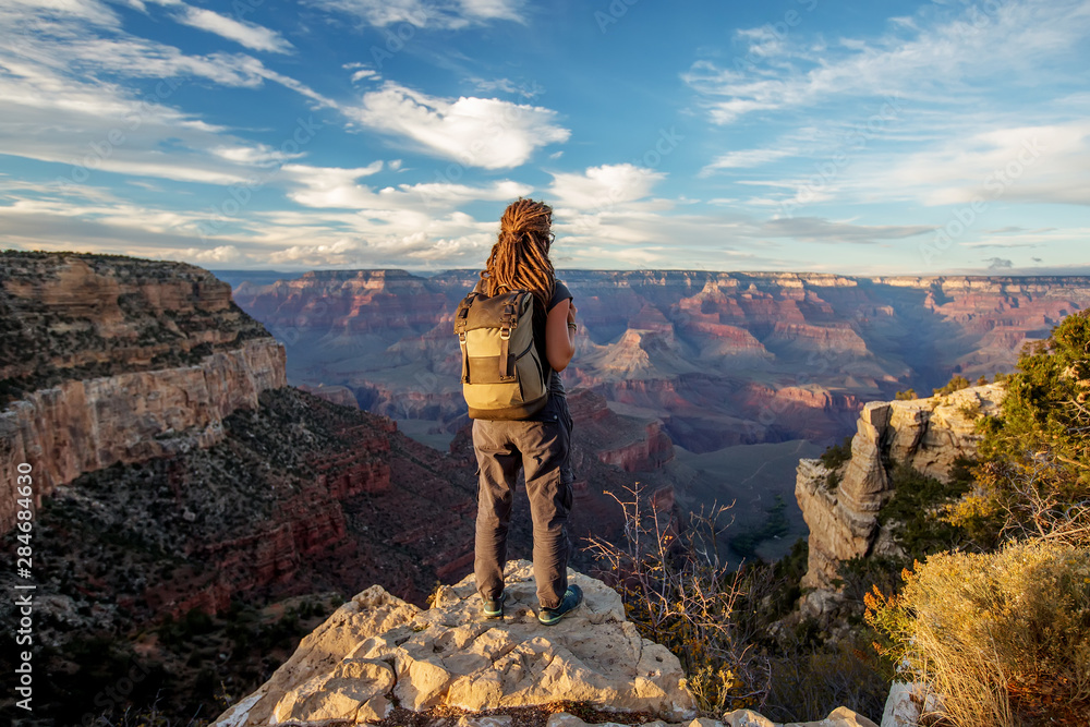 A hiker in the Grand Canyon National Park, South Rim, Arizona, USA. A hiker in the Grand Canyon National Park, South Rim, Arizona, USA.