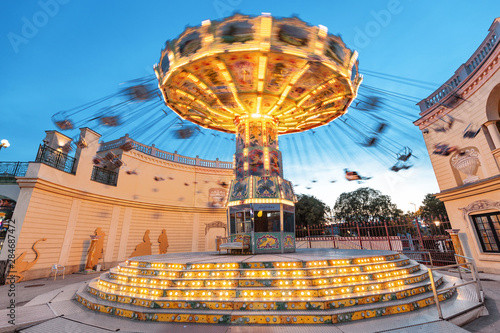 Tableau sur toile Illuminated carousel in Prater park, long exposure motion blur