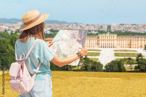 Canvas Print 20 July 2019, Vienna, Austria: Happy young asian woman travel in Schoenbrunn royal palace garden
