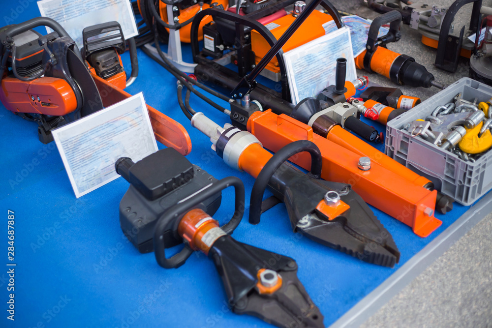 Special equipment of rescue worker - metal cutters, chainsaw at emergency services show