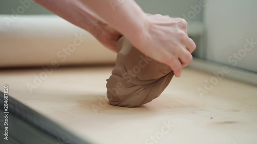 Wallpaper Mural The hands of the master crumple a piece of clay Torontodigital.ca
