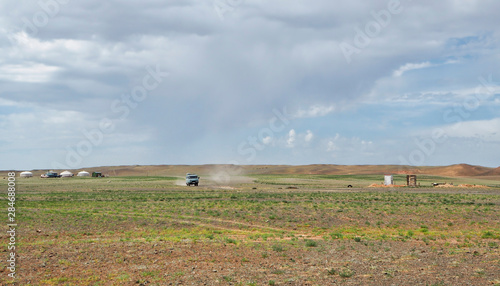 Russian Vans driving on a secluded road, Mongolia