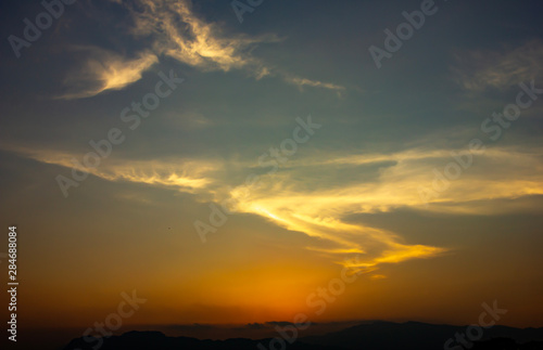 Sky sunset scenery,background Whether it's the warm hues of a sunrise or sunset, shimmering reflection of the sun on the clouds, the sky and clouds have the power to inspire feelings of awe and wonder © Charisia