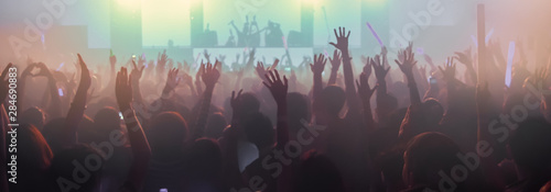 Festival , Party People Club Concert. Entertainment Concert Young man and girl enjoying and Applauding . Celebration party festival happiness. Concert Show with DJ Music EDM on Stage City Party.