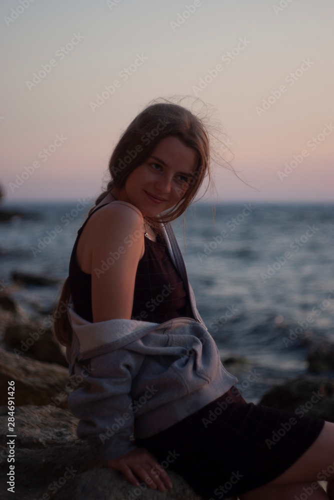 beautiful young blonde on a background of the sea beautiful young blonde on a background of the sea