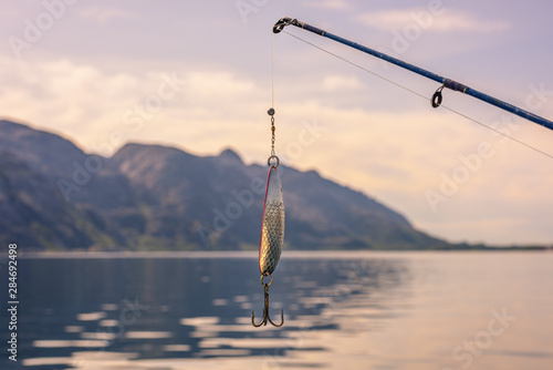 Fishing Hook and Rod In Beautiful Norwegian Landscape
