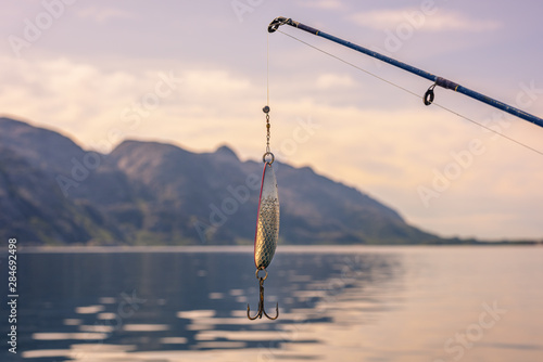 Fishing Hook and Rod In Beautiful Norwegian Landscape photo