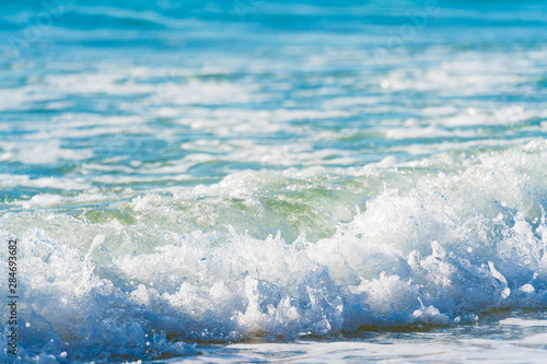 Sea surf on a sandy beach Canary Islands