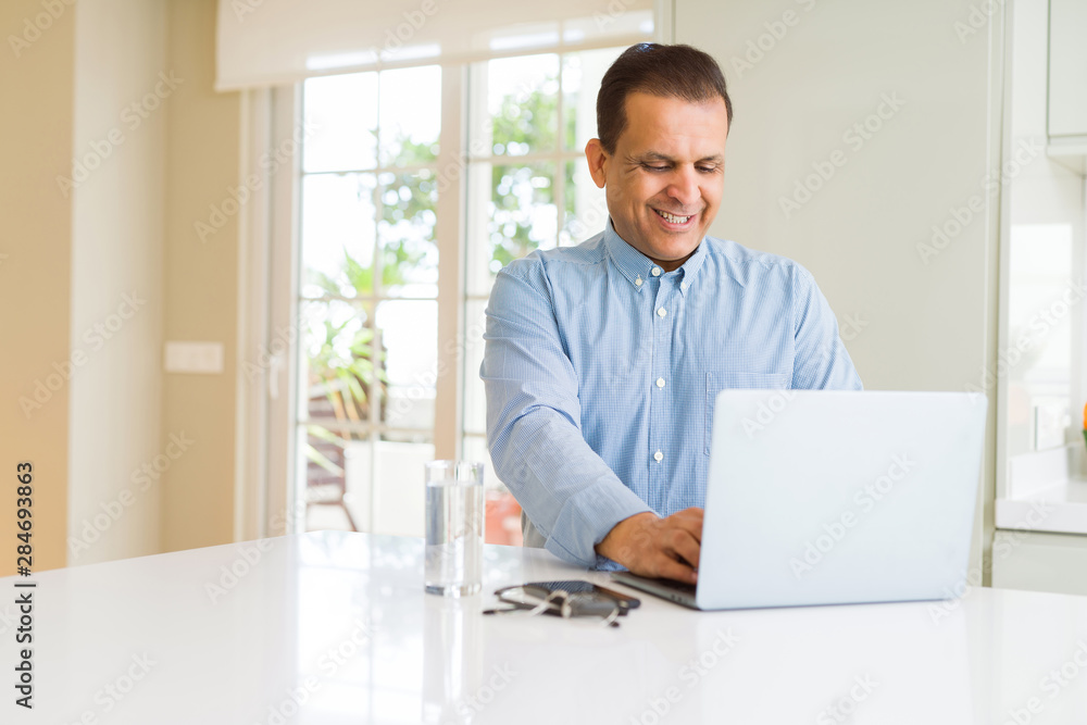 Middle age man using computer laptop