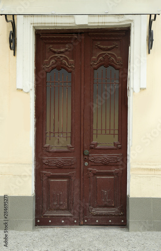 Closed vintage wooden door in old building