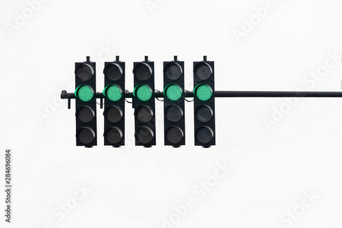 Green traffic light on white isolated background.